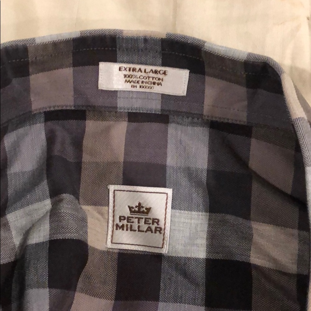Men’s long sleeved checkered dress shirt.